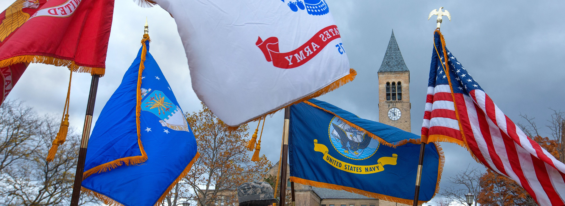 military flags waving in front of McGraw Tower