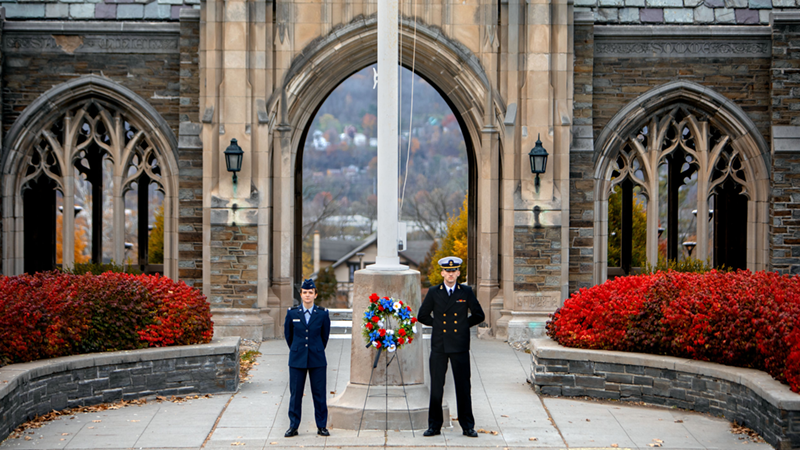 uniformed personnel in front of War Memorial building