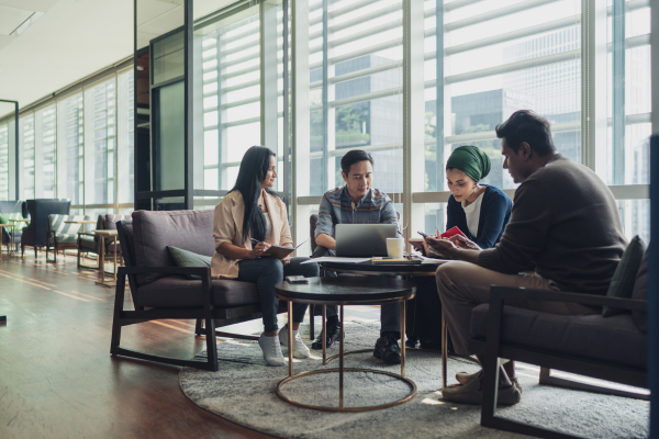 Group of people sitting around a table