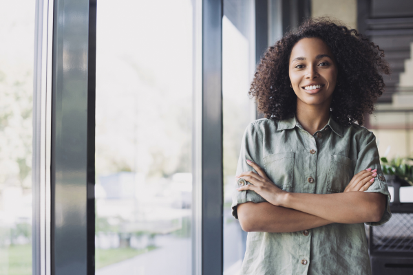 woman smiling with arms crossed