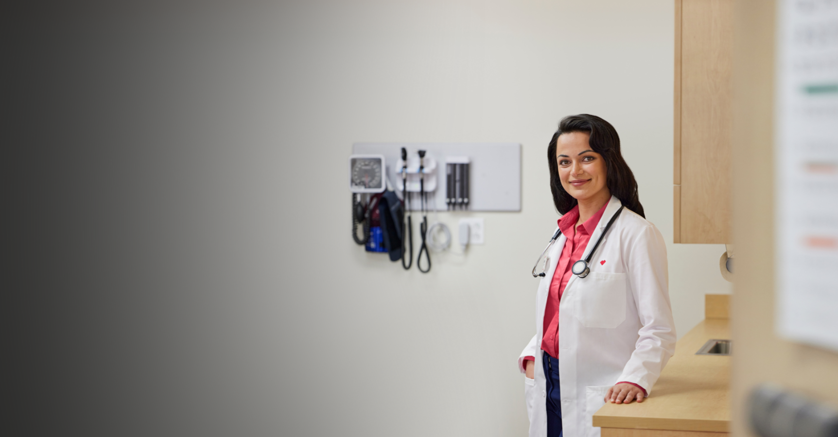 Image of a female provider smiling in clinic