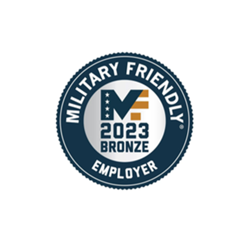 Circular badge with a gear-shaped edge, featuring "MILITARY FRIENDLY" at the top, "EMPLOYER" at the bottom, and "2023 BRONZE" with a stylized "MF" in the center, incorporating the American flag colors and stars.