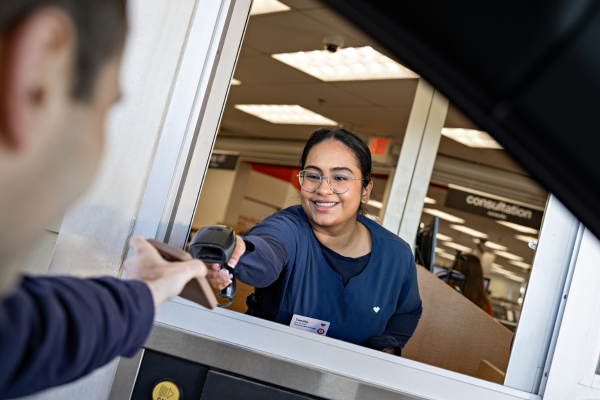Female Pharmacy Tech at drive thru window