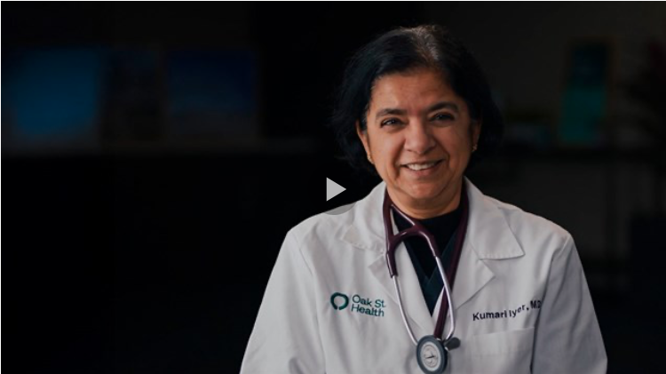 A woman wearing a white coat and stethoscope