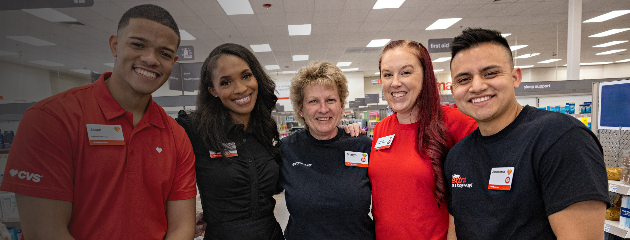 Group of CVS Health retail employees inside a pharmacy.