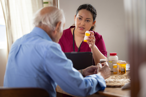 A healthcare professional explaining medication.