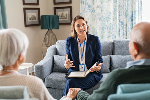 A woman explaining to two people