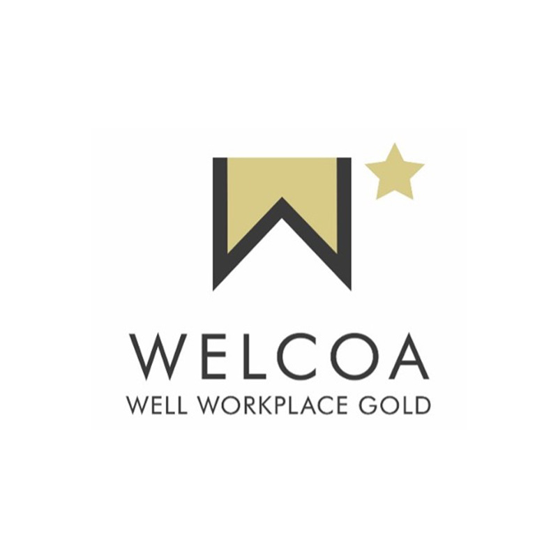 A logo features a gold banner with a black inverted triangle at its center, followed by a gold star to its right. Below, the text reads "WELCOA" and "WELL WORKPLACE GOLD.