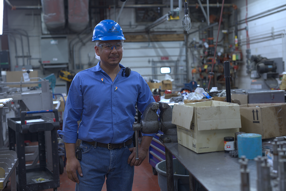 A maintenance team member in the maintenance shed