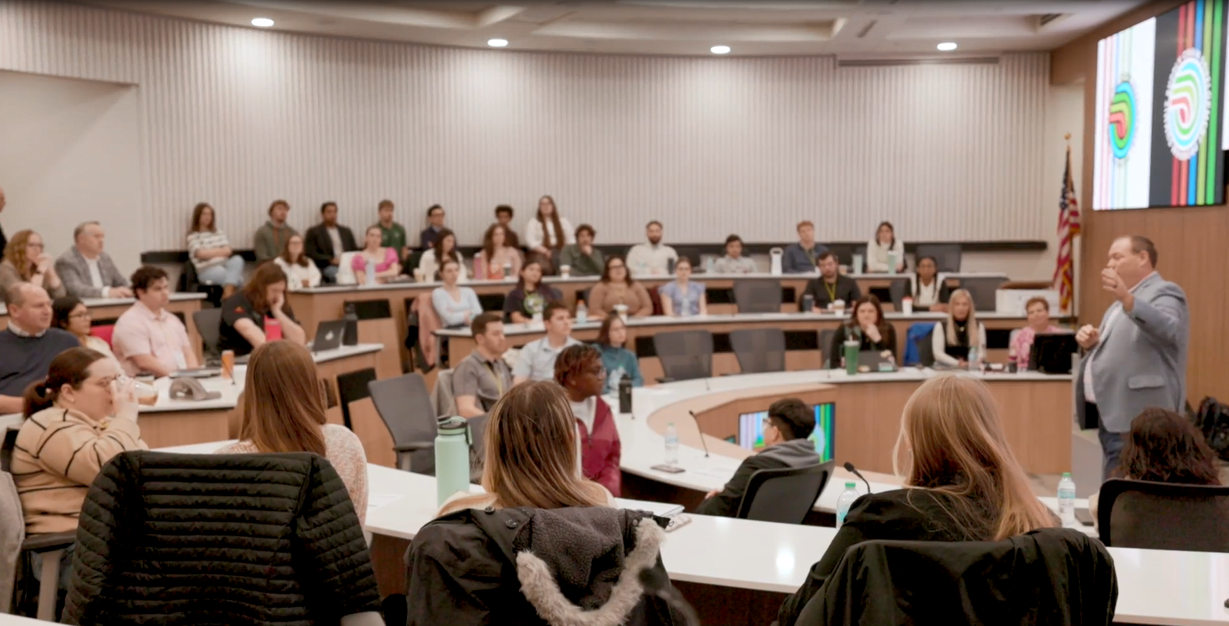 Early Talent in an auditorium listening to a speaker