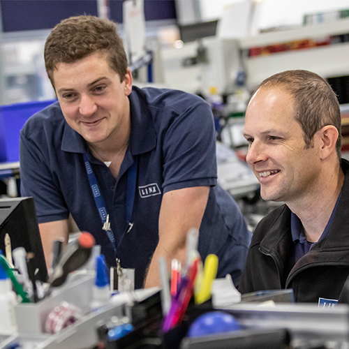 Photograph of LINX associates working in factory