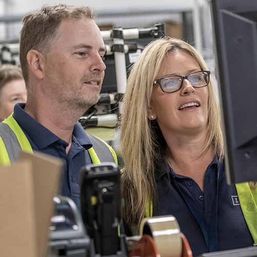Photograph of LINX associates in factory