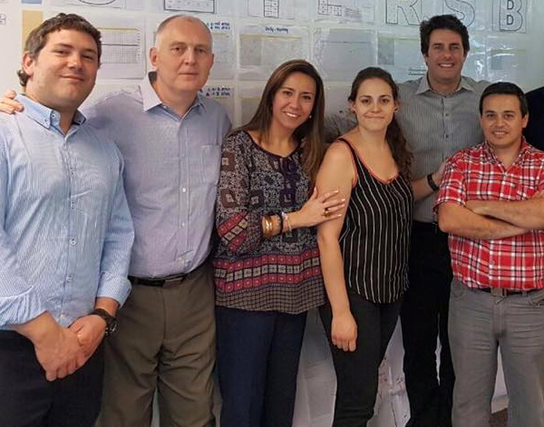 Photograph of Videojet associates in front of presentation board