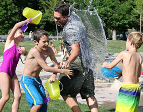 Photograph of Leica Microsystems associates and kids playing