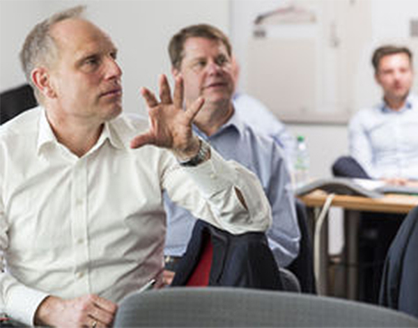 Photograph of Leica Microsystems associates in meeting