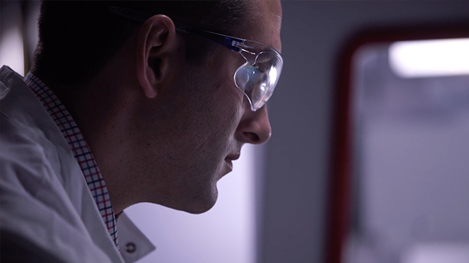 Photograph of Beckman Coulter LS associate in lab