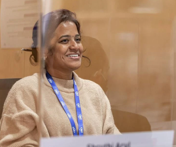 image of shruthi arul sitting in an office