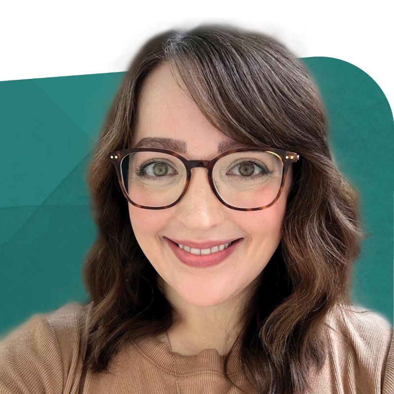 Amy Wrede, Veralto Enterprise System Leader, smiling against a teal background