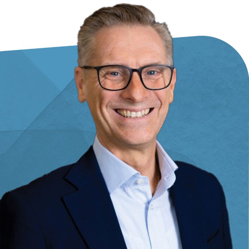 Franz Ippolito, General Manager of Hach Italy, smiling against a blue background