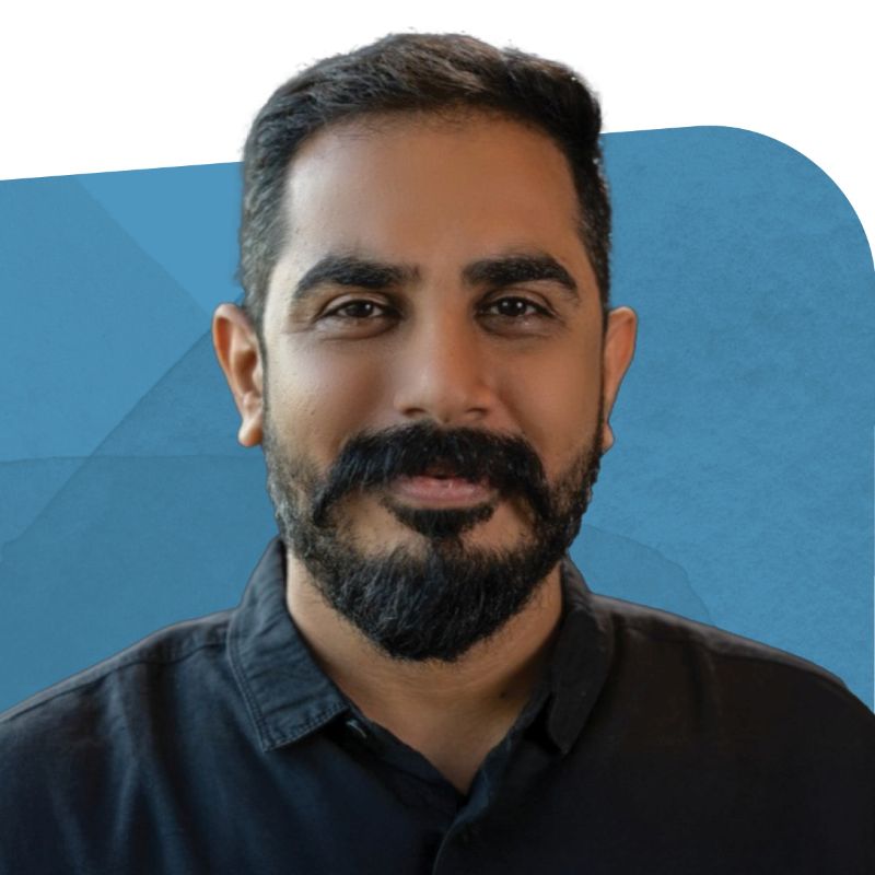 Sumeet Sachdeva, Sr. Manager of Inside Sales and Application Development, smiling against a blue background