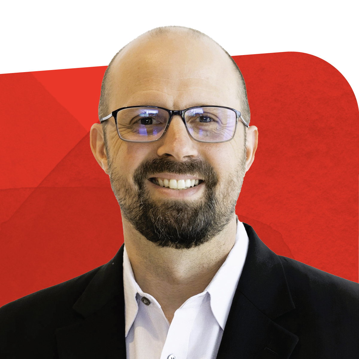 Andrew Mattern, Warehouse Operations Supervisor, smiling against a red background 