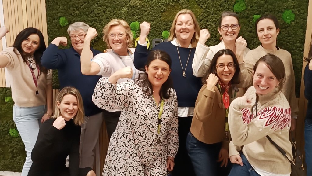 Members of Belonging in EMEA striking a pose together