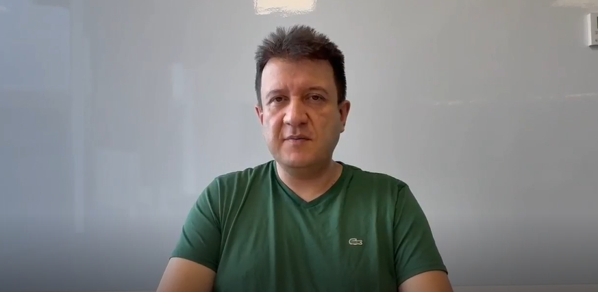 A DHL employee documenting the interview.