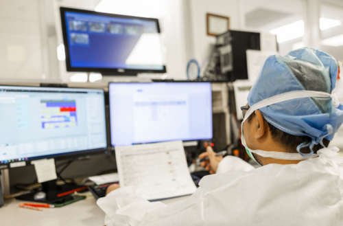 Team member works with computers.