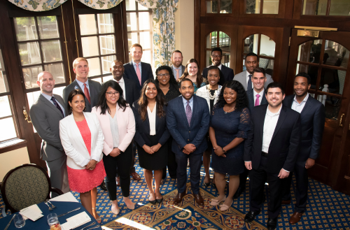 A group of administrative fellows smile together at Duke.