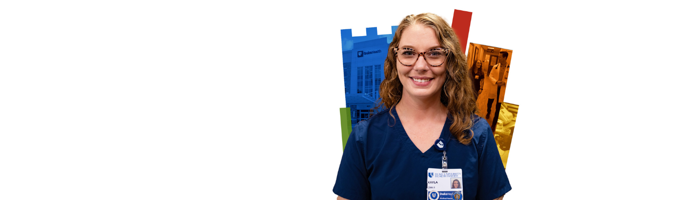 Kayla smiles in glasses and scrubs in front of a colorful Duke shield.