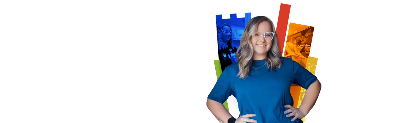 Lauralin smiles in a blue shirt and glasses with a colorful Duke Health shield in the background