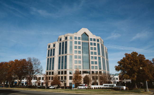 Sunny blue sky above the corporate Duke Health offices. 