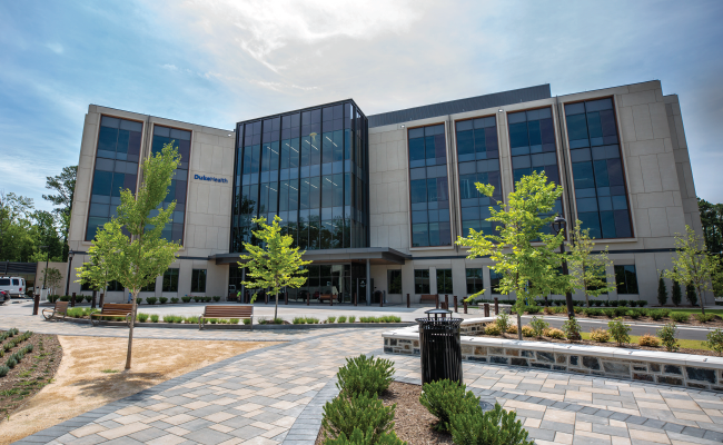 Sunny sky above a Duke Primary Care building. 