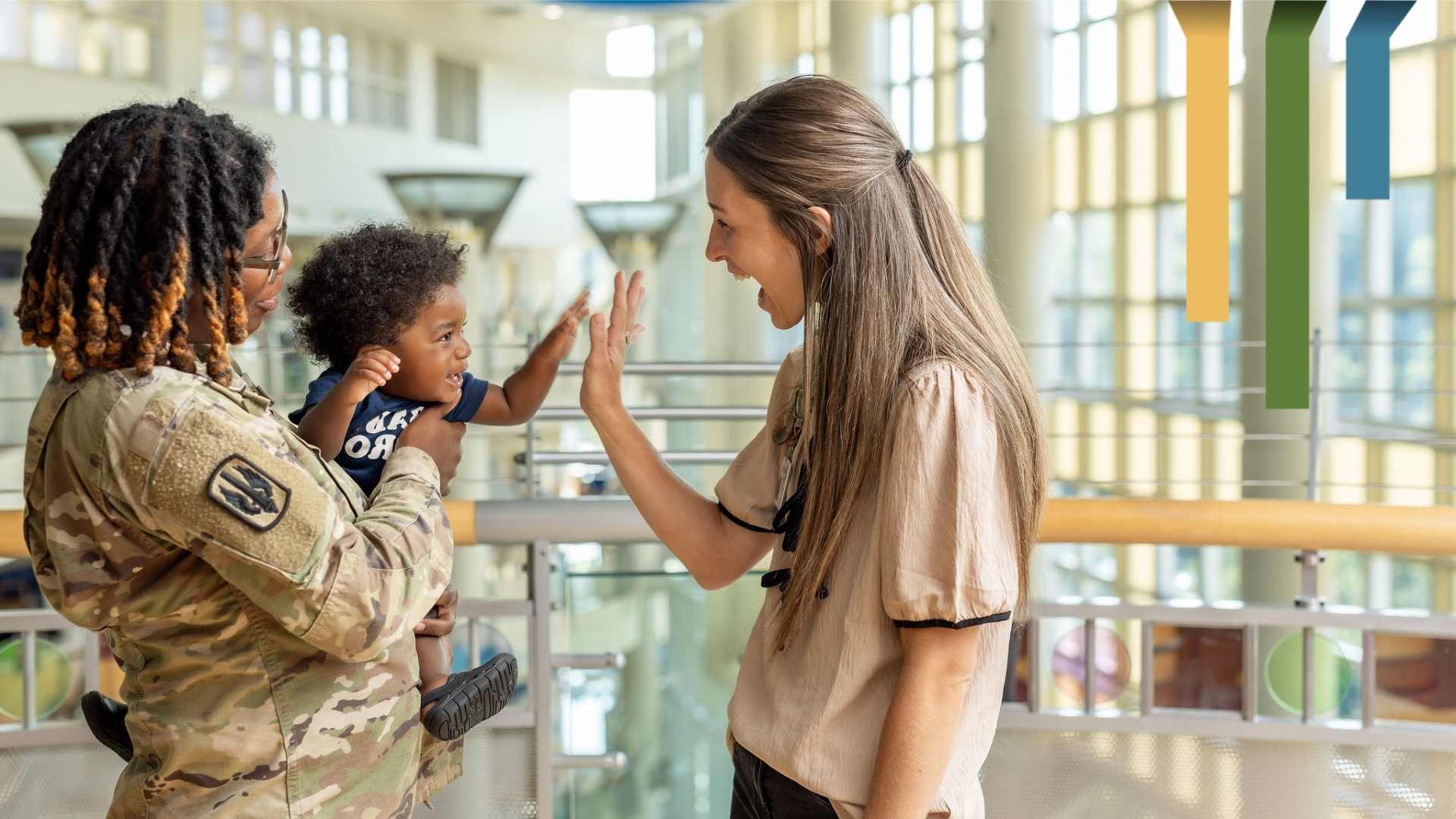Team member and veteran give high fives.