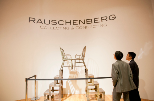 Two men look at an exhibit at the Nasher Museum of Art.