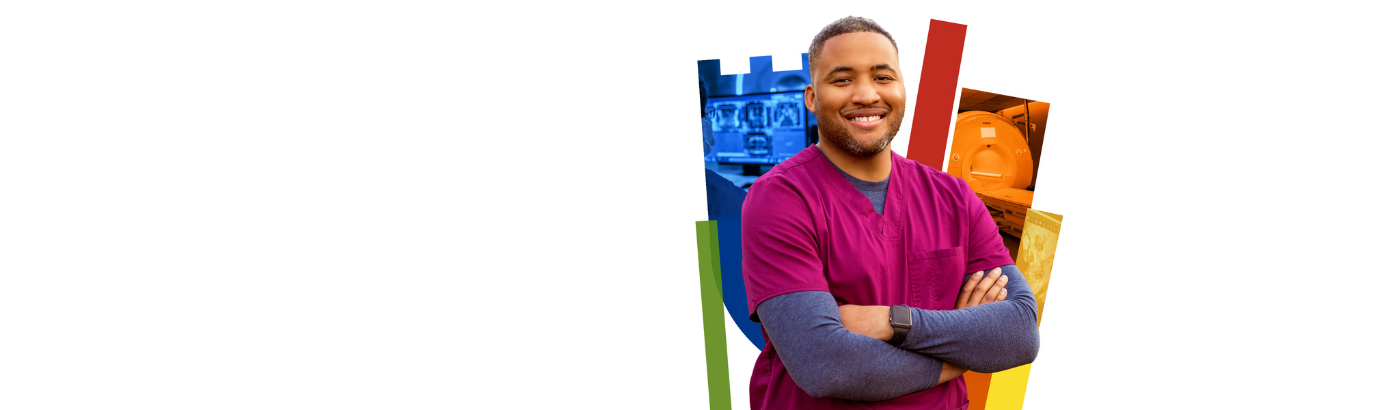 Imaging team member smiles with colorful Duke shield in the background.