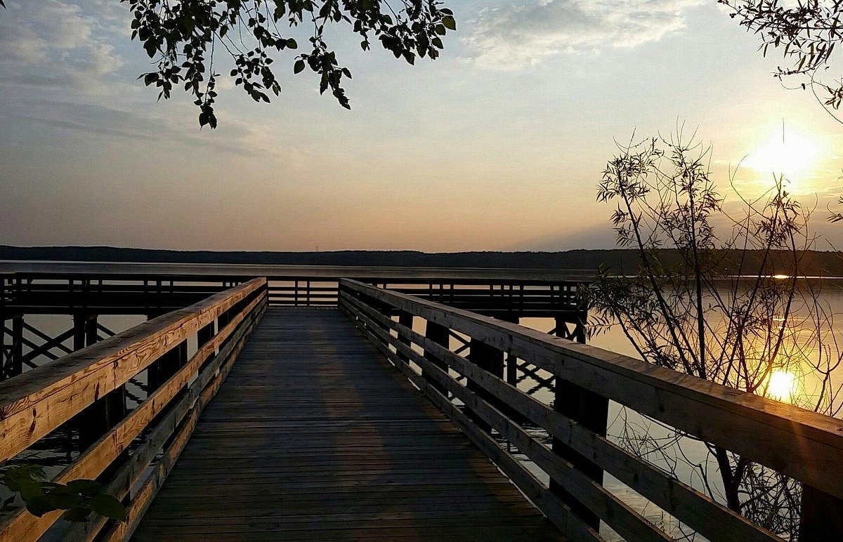 Dock over Falls Lake at sunset.