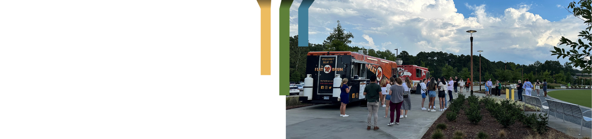 team members standing outside near food trucks at new talent welcome mixer.