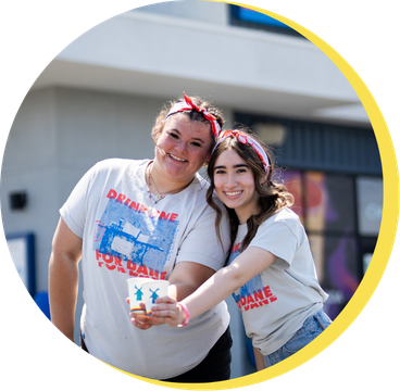 Drink one for Dane day, Broista's smiling and holding cups as a cheers