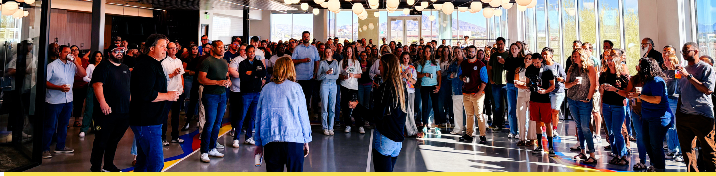 HQ crew, large group of people standing in office