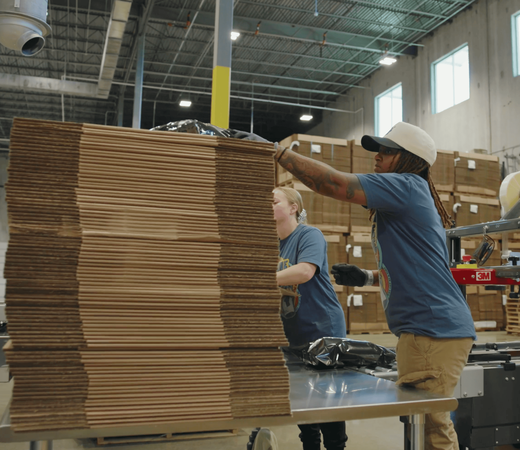 Roasting Facility: People making boxes