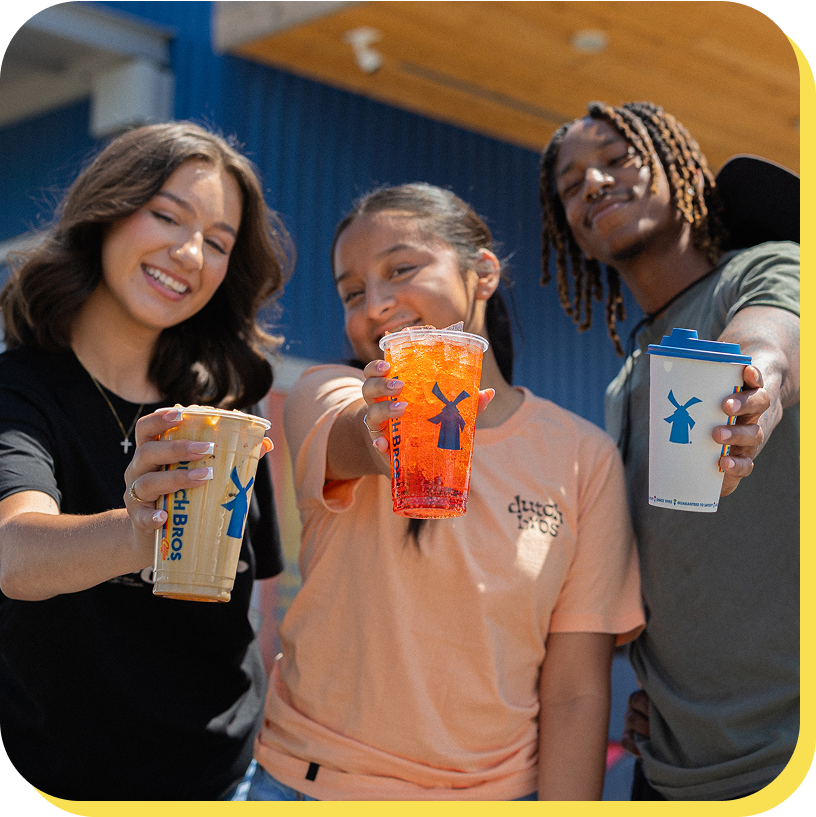 Brositas smiling holding different Dutch Bros drinks
