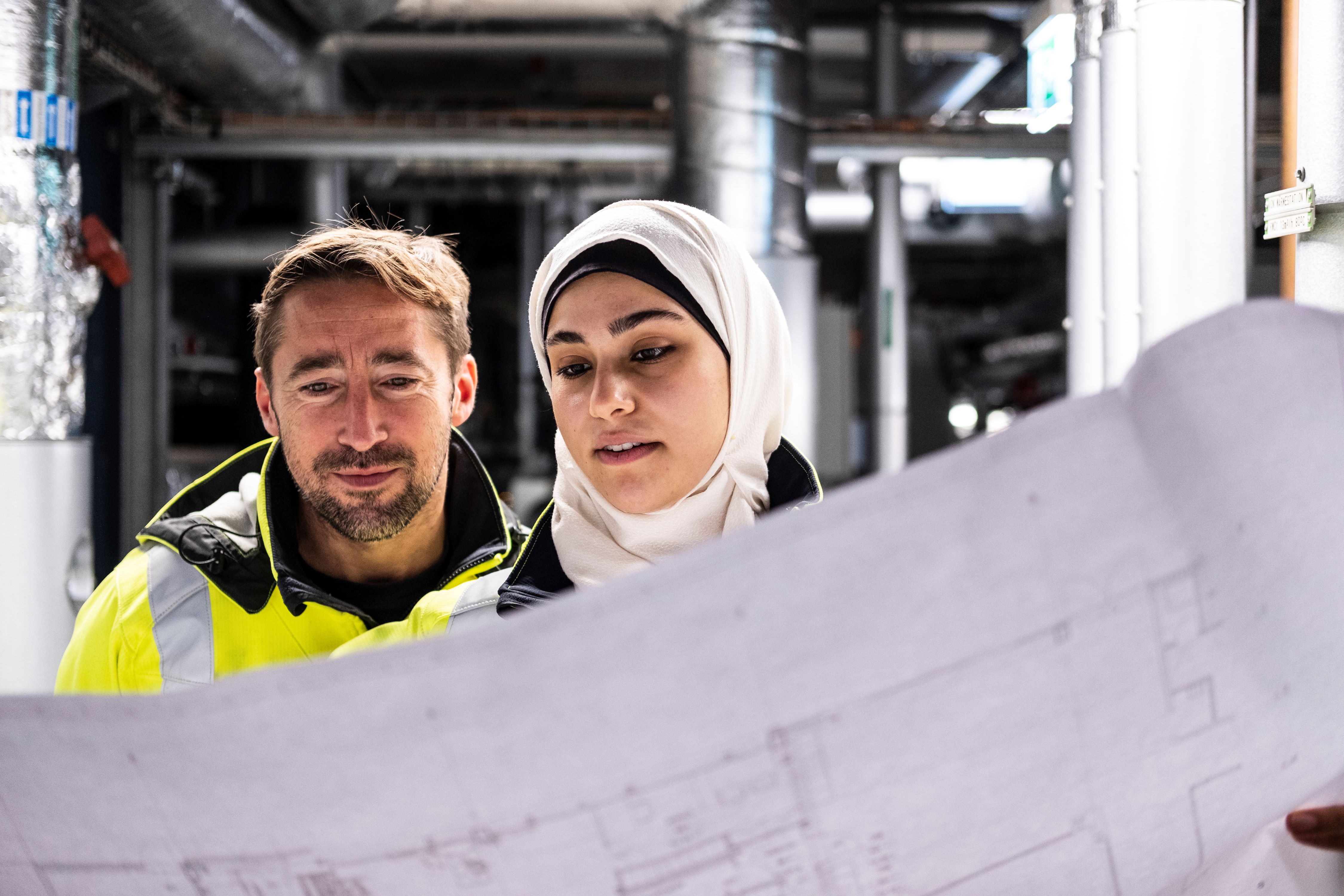 Two Exyte engineers working on site