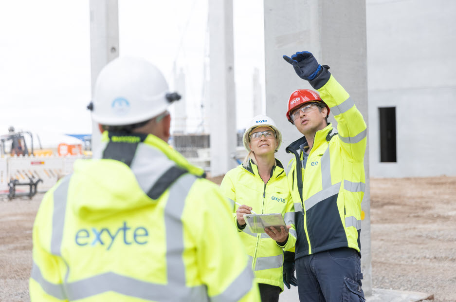 Photos of Exyte employees in safety gear on project site