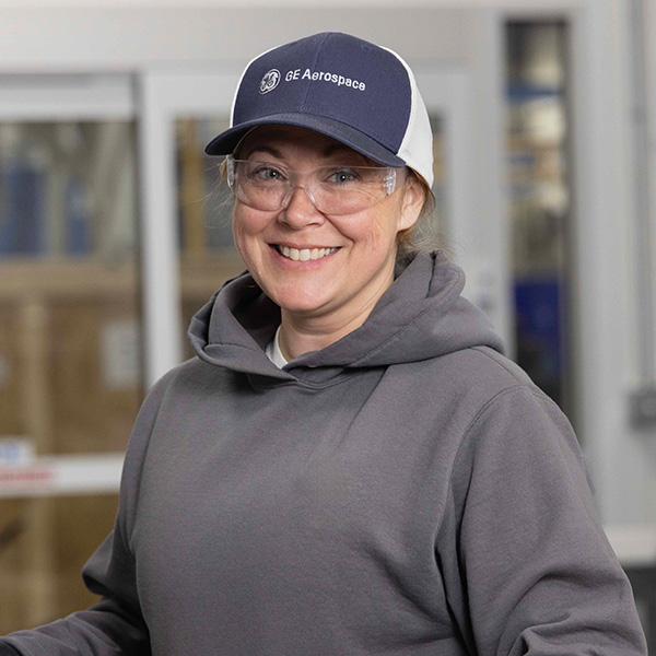 woman in hat and safety glasses