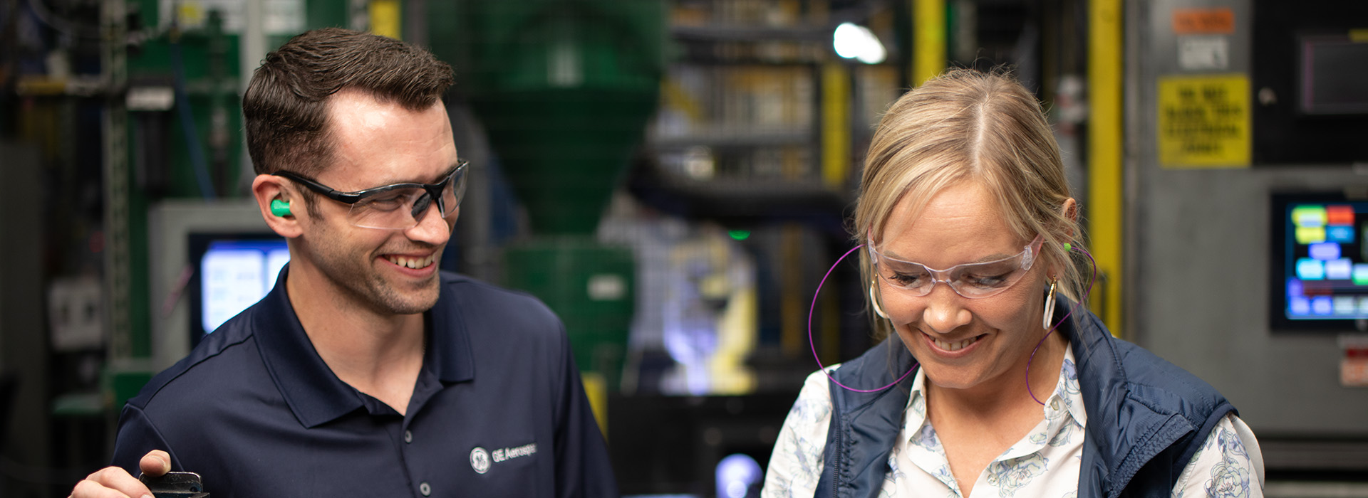 Man and woman working in factory