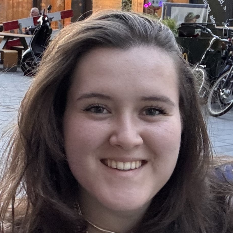 A young woman smiling with brown hair
