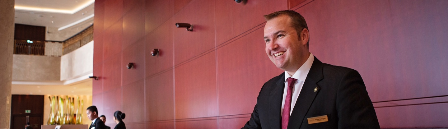 Team Member checking-in a guest at the front desk