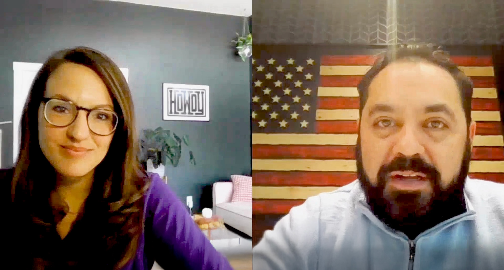 A woman with glasses and long brown hair and a man with a beard speak during a video call. The woman sits in a modern room, and the man has a large American flag on the wall behind him.