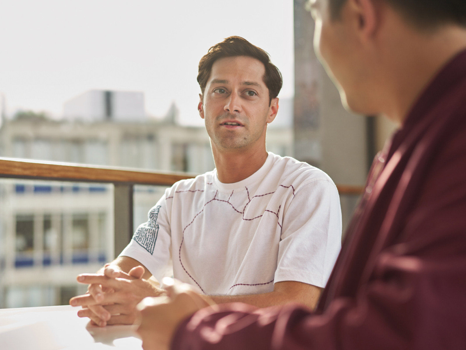 Young man sitting at a table